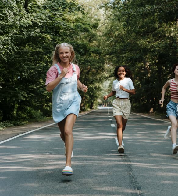 Teen friends running